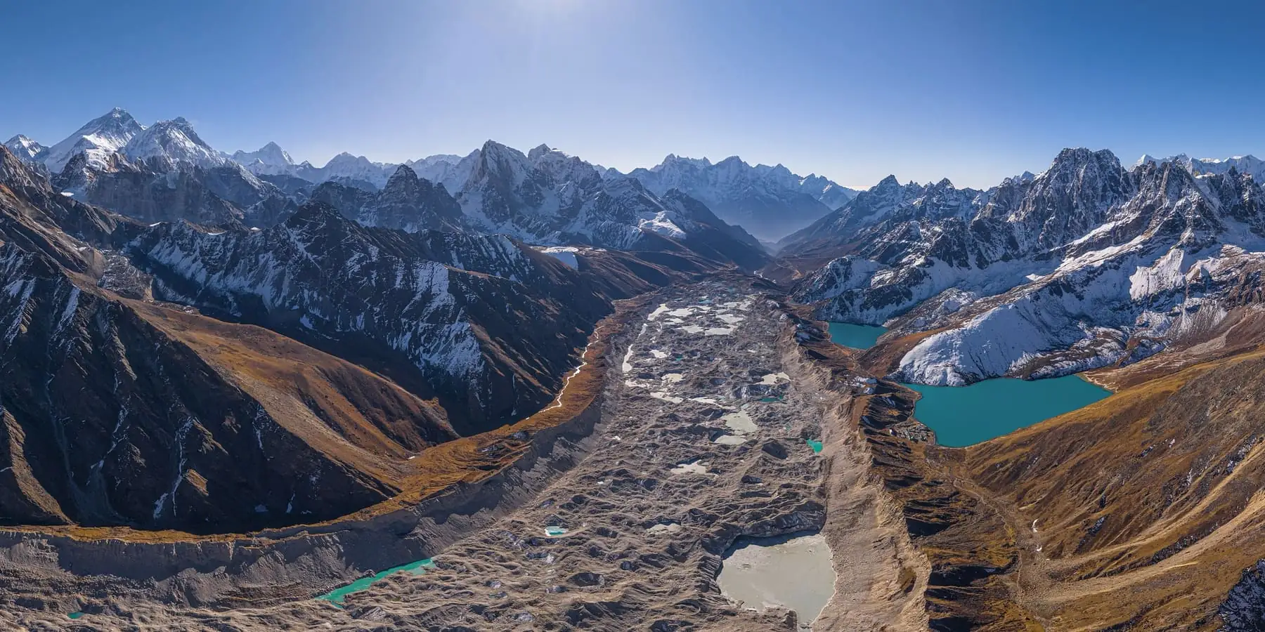 The Ngozumpa glacier and the Gokyo lakes from a ridge, under the peaks of Khumbu
